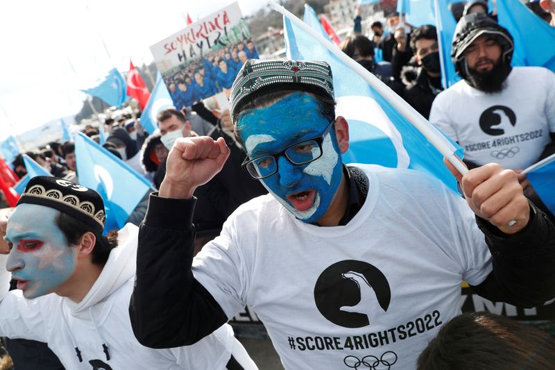 &copy; Reuters. People from China's Uyghur Muslim ethnic group shout slogans during a rally against the 2022 Beijing Winter Olympic Games over China's treatment of the minority, near the Chinese consulate in Istanbul, Turkey February 4, 2022. REUTERS/Murad Sezer