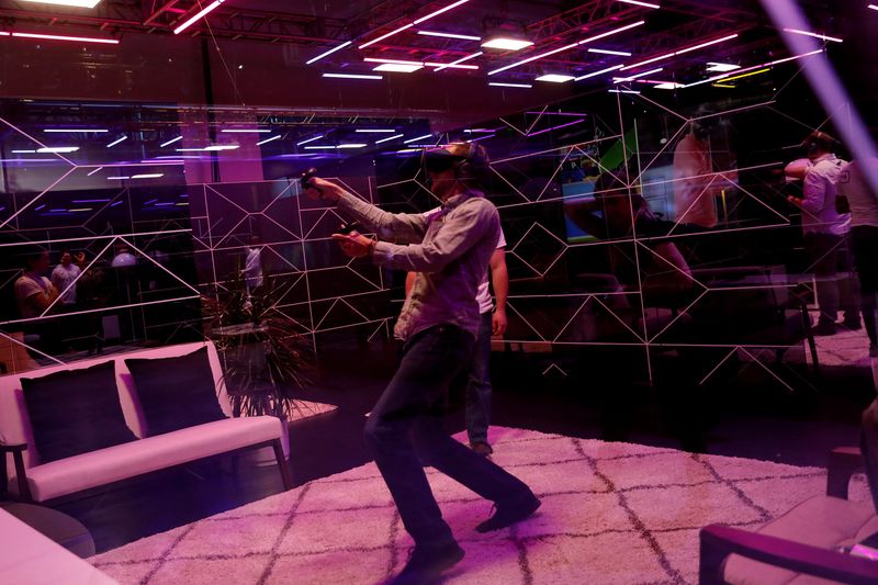 &copy; Reuters. FILE PHOTO: An attendee demos the Oculus Quest wireless virtual reality headset during Facebook Inc's F8 developers conference in San Jose, California, U.S., April 30, 2019. REUTERS/Stephen Lam/File Photo