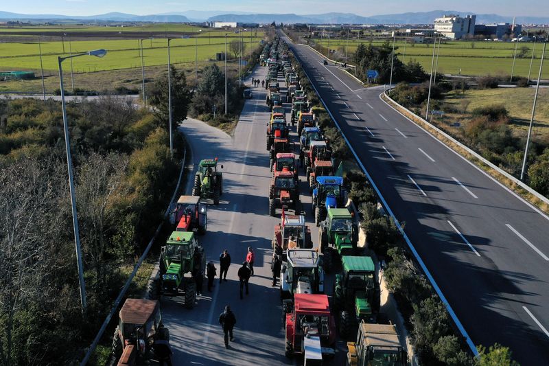 &copy; Reuters. Tractors are seen on national highway as Greek farmers take part in a demonstration against the rising cost of fuel and electricity, near the town of Larissa, Greece, February 4, 2022. Picture taken with a drone. REUTERS/Alexandros Avramidis