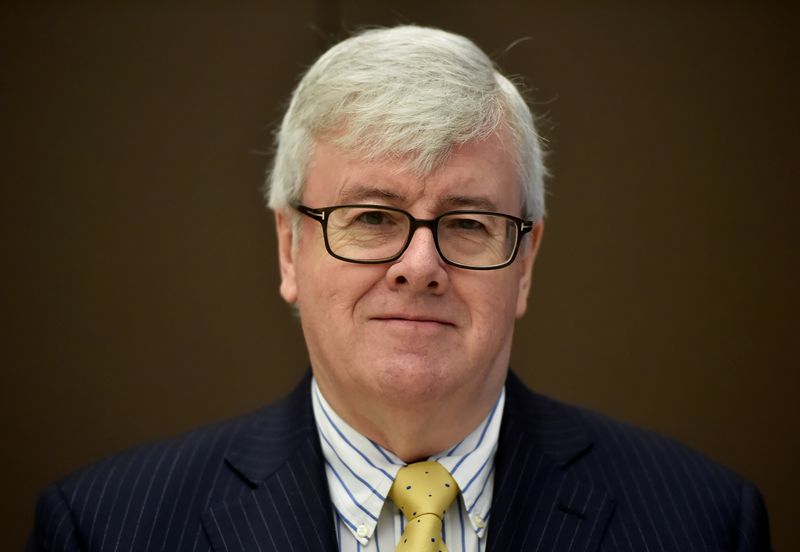 &copy; Reuters. FILE PHOTO: Tesco Non-executive chairman, John Allan poses for a photograph in London, Britain, April 12, 2017. REUTERS/Hannah McKay