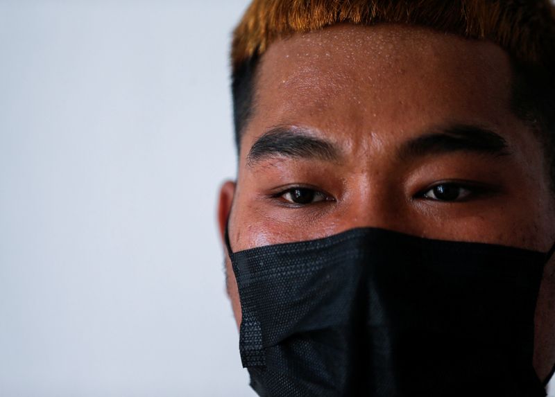 © Reuters. FILE PHOTO: Lin Lin Bo Bo, whose parents cut ties with him, talks during an interview with Reuters, at Thai-Myanmar border, January 26, 2022. REUTERS/Soe Zeya Tun