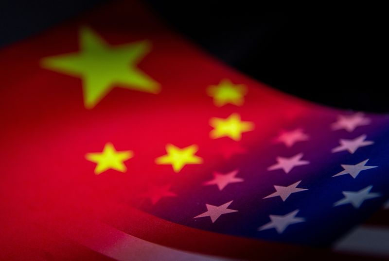 &copy; Reuters. FILE PHOTO: China's and U.S.' flags are seen printed on paper in this illustration taken January 27, 2022. REUTERS/Dado Ruvic/Illustration