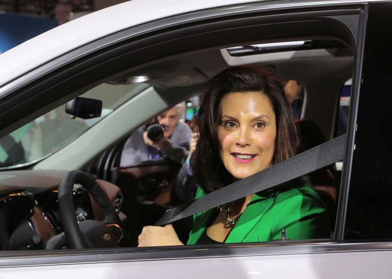 &copy; Reuters. FILE PHOTO: Michigan Governor Gretchen Whitmer sits in a 2019 Chevrolet Traverse, assembled in Lansing, Michigan, at the General Motors display area during the North American International Auto Show in Detroit, Michigan, U.S., January 15, 2019. REUTERS/Re