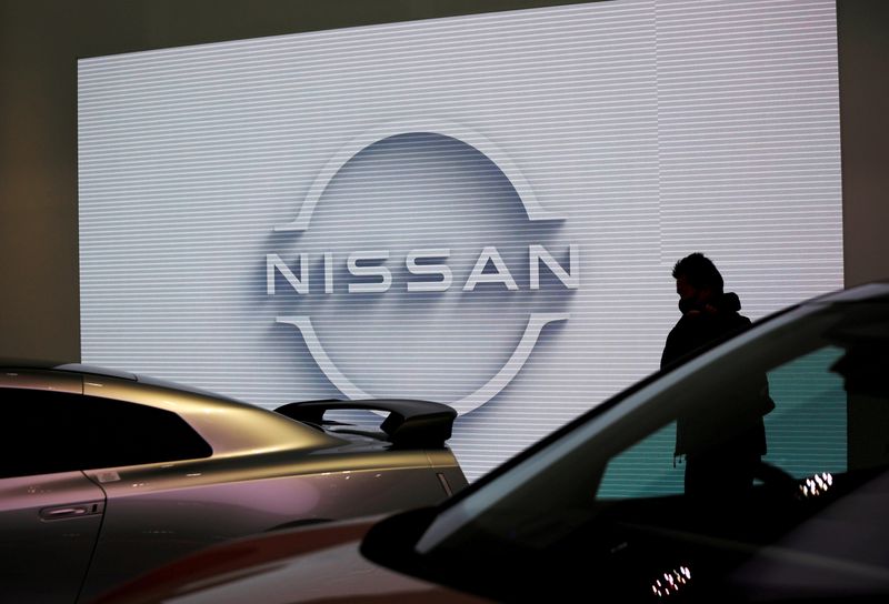 &copy; Reuters. FILE PHOTO: A visitor is seen at a Nissan Motor Corp. showroom in Tokyo, Japan November 11, 2020.  REUTERS/Issei Kato/File Photo