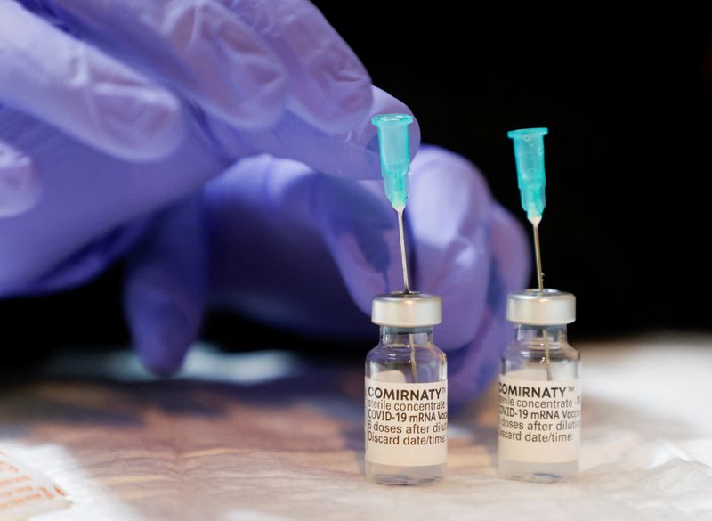 &copy; Reuters. FILE PHOTO: Vials filled with Comirnaty, the Pfizer-BioNTech vaccine against the coronavirus disease (COVID-19), are seen at a vaccination center in St. Stephen's Cathedral, in Vienna, Austria February 5, 2022.  REUTERS/Leonhard Foeger