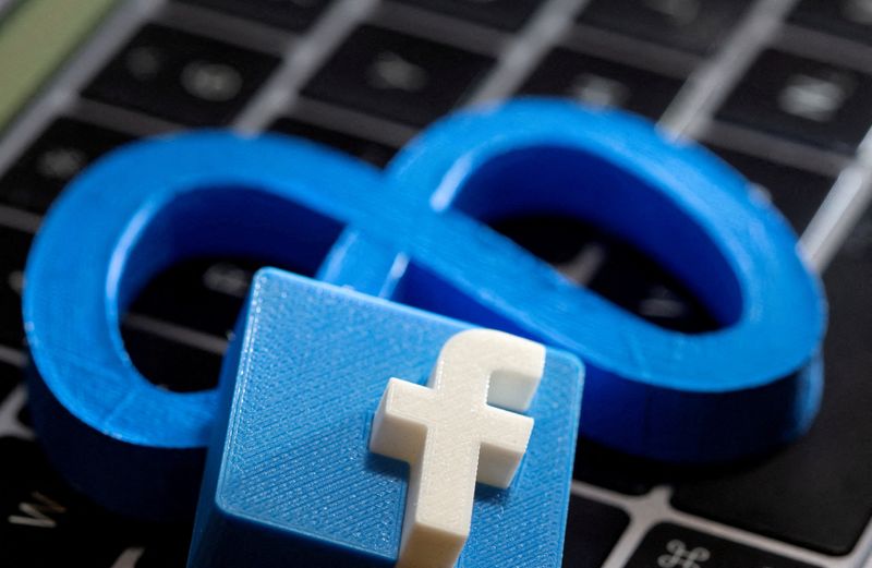 &copy; Reuters. FILE PHOTO: A 3D-printed Facebook's new rebrand logo Meta and Facebook logo are placed on laptop keyboard in this illustration taken on November 2, 2021. REUTERS/Dado Ruvic/Illustration/File Photo