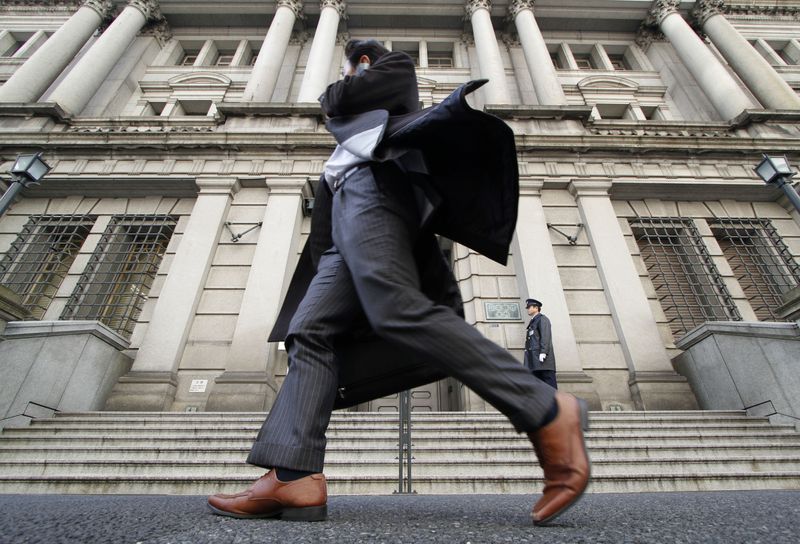 &copy; Reuters. FILE PHOTO: A man walks past the Bank of Japan building in Tokyo March 17, 2010.  REUTERS/Toru Hanai 