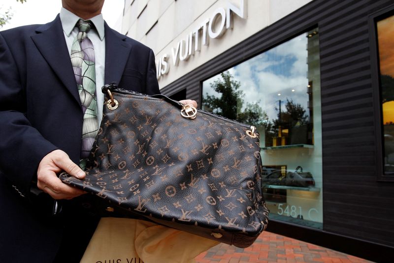 &copy; Reuters. FILE PHOTO: A fake LVMH handbag is displayed to the photographer outside a Louis Vuitton store in Chevy Chase, Maryland, October 5, 2010.REUTERS/Hyungwon Kang/File Photo