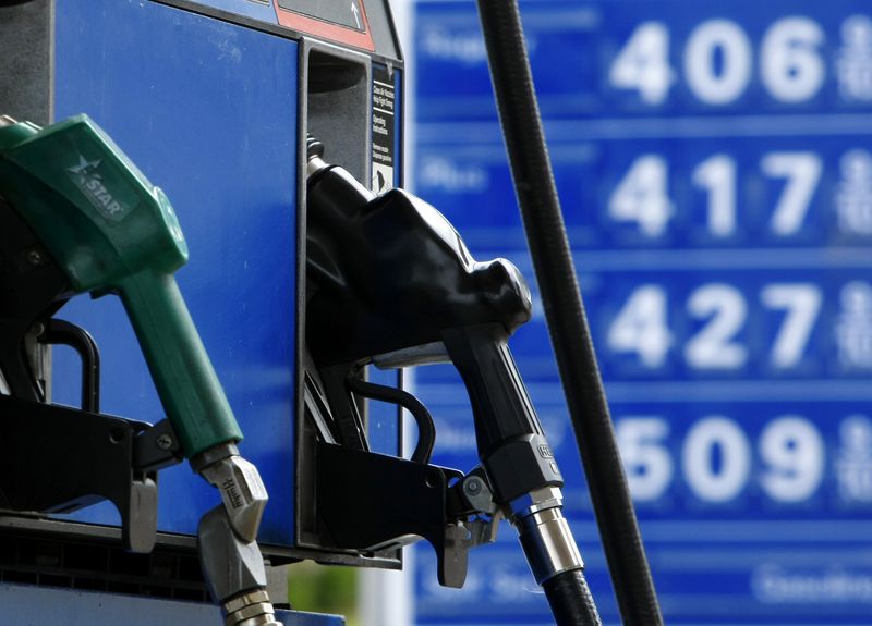 &copy; Reuters. FILE PHOTO - Gas and diesel pumps along with gas prices are shown at an Exxon gas station in Carlsbad, California May 28, 2008. REUTERS/Mike Blake (UNITED STATES)