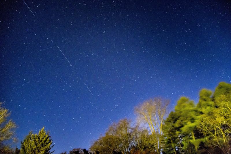 &copy; Reuters. FILE PHOTO: SpaceX Starlink 5 satellites are pictured in the sky seen from Svendborg on South Funen, Denmark April 21, 2020. Ritzau Scanpix/Mads Claus Rasmussen via REUTERS 