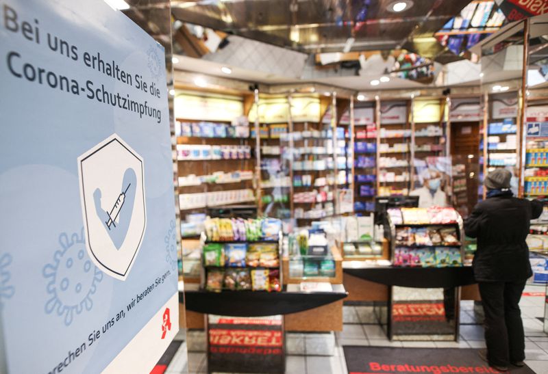 &copy; Reuters. FILE PHOTO: A placard reading 'You can receive your coronavirus vaccine from us" is pictured in the 'Europa Apotheke' pharmacy on the first day trained pharmacies carry out COVID-19 vaccinations amid the corovavirus disease pandemic in Dusseldorf, Germany