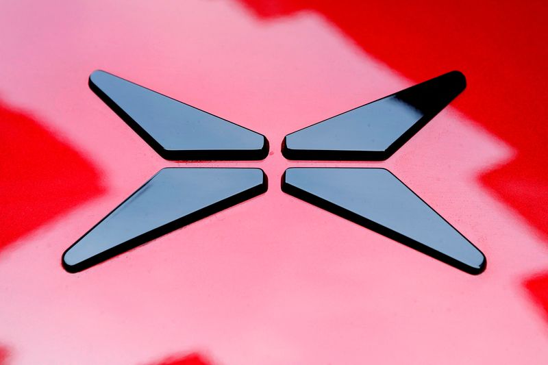 &copy; Reuters. FILE PHOTO: The logo on an XPeng Inc. P7 performance electric vehicle is seen outside the New York Stock Exchange in New York, U.S., August 27, 2020. REUTERS/Mike Segar