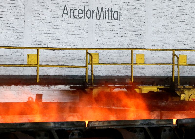 &copy; Reuters. FILE PHOTO: The logo of ArcelorMittal is pictured in front of heat rising from a red-hot steel plate at the ArcelorMittal steel plant in Ghent, Belgium, July 7, 2016. REUTERS/Francois Lenoir