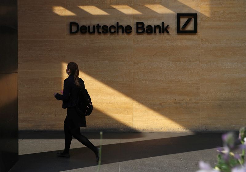 &copy; Reuters. FILE PHOTO: A woman walks past a Deutsche Bank office in London, Britain July 8, 2019. REUTERS/Simon Dawson