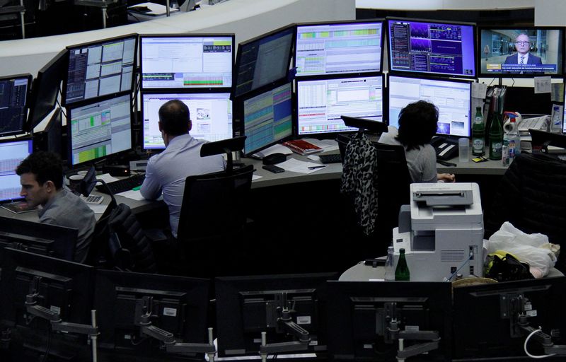 &copy; Reuters. FILE PHOTO: Traders work at their desks at the stock exchange in Frankfurt, Germany, November 22, 2017.    REUTERS/Staff/Remote