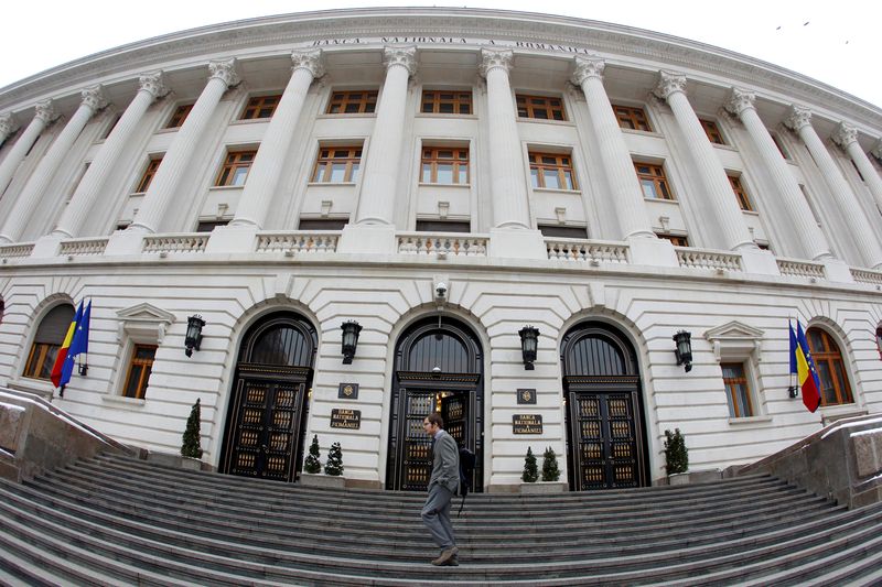 &copy; Reuters. FILE PHOTO: A man walks in front of Romania's Central Bank headquarters during a news conference of the International Monetary Fund (IMF)'s Romania mission in Bucharest, Romania January 29, 2013. REUTERS/Bogdan Cristel