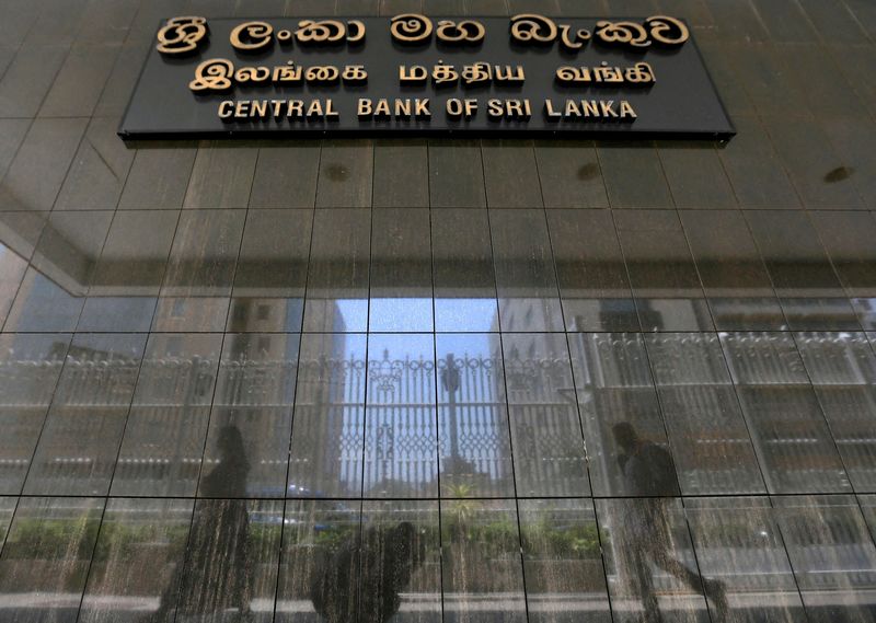 &copy; Reuters. FILE PHOTO: People walk past the main entrance of the Sri Lanka's Central Bank in Colombo, Sri Lanka March 24, 2017. REUTERS/Dinuka Liyanawatte/File Photo