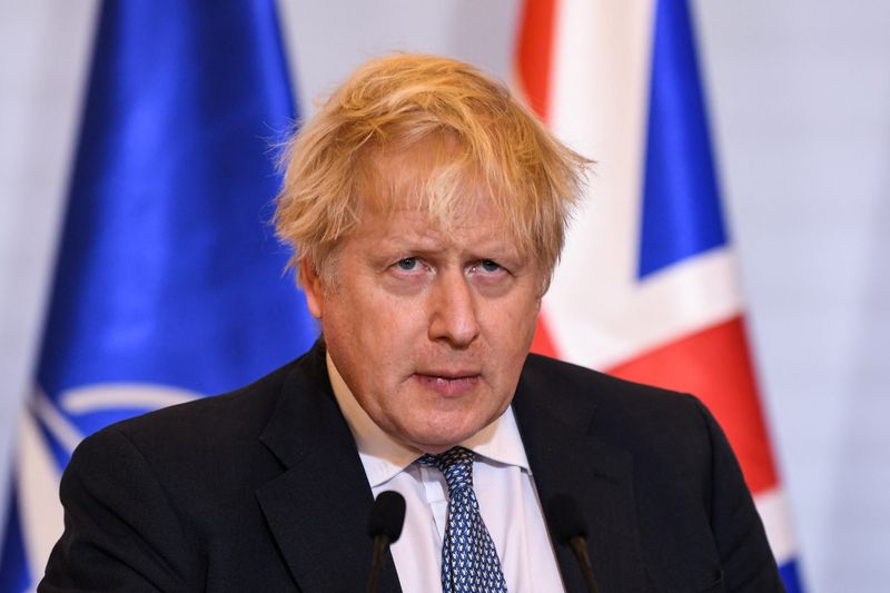 &copy; Reuters. FILE PHOTO: Britain's Prime Minister Boris Johnson reacts during a joint news conference with Polish Prime Minister Mateusz Morawiecki (unseen) in Warsaw, Poland February 10, 2022 following a meeting. Daniel Leal/Pool via REUTERS