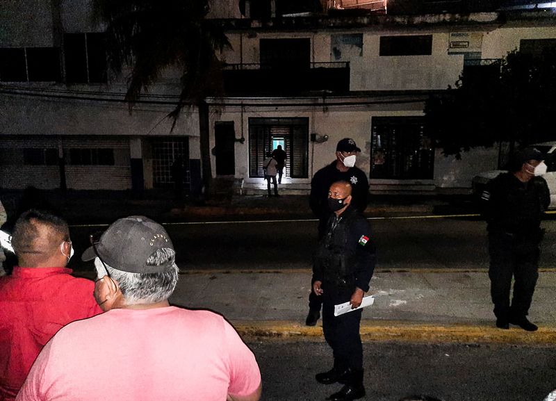 &copy; Reuters. FILE PHOTO: Police officers guard the perimeter of a scene where Heber Lopez, an independent journalist who ran NoticiasWeb, was shot and killed at his recording studio, in Salina Cruz, in Oaxaca state, Mexico February 10, 2022. REUTERS/Stringer 