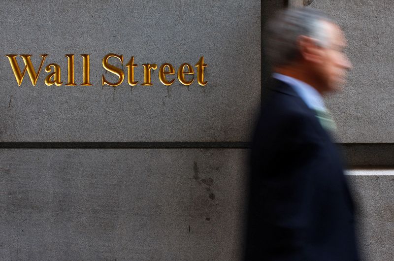 &copy; Reuters. FILE PHOTO: A man walks along Wall Street in New York September 18, 2008. REUTERS/Eric Thayer/File Photo