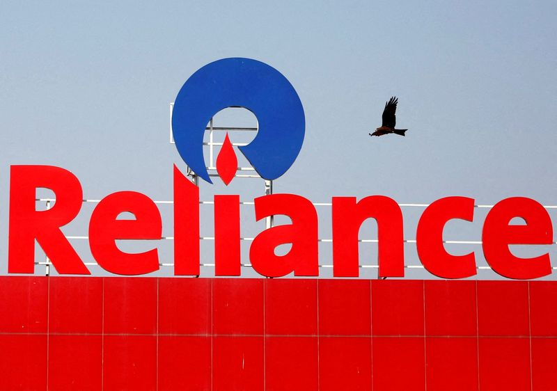 &copy; Reuters. FILE PHOTO: A bird flies past a Reliance Industries logo installed on its mart in Ahmedabad, India January 16, 2017. REUTERS/Amit Dave/File Photo