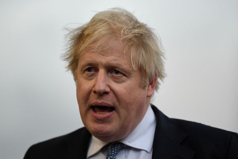 &copy; Reuters. FILE PHOTO: Britain's Prime Minister Boris Johnson speaks with members of the media during a visit to Warszawska Brygada Pancerna military base near Warsaw, Poland February 10, 2022. Daniel Leal/Pool via REUTERS