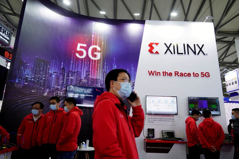 &copy; Reuters. FILE PHOTO: Staff members stand at a Xilinx Inc booth at the Mobile World Congress (MWC) in Shanghai, China February 23, 2021. REUTERS/Aly Song/File Photo