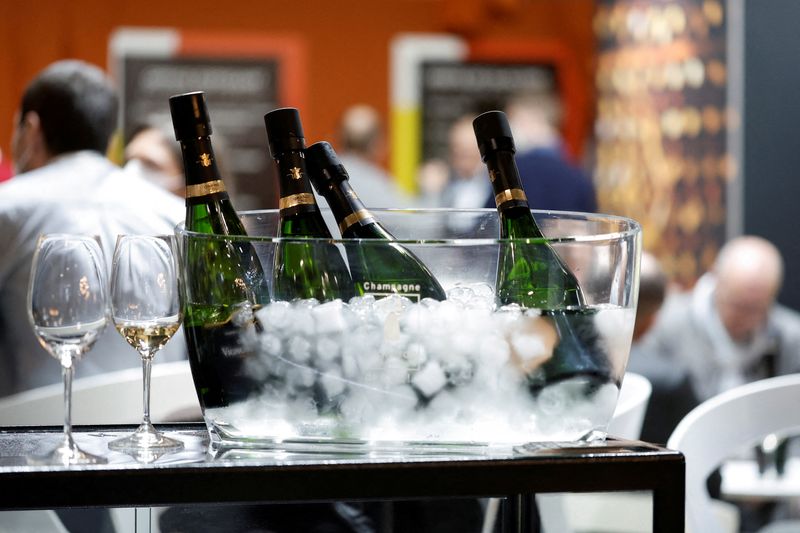 &copy; Reuters. FILE PHOTO: Bottles of champagne are displayed on a stand at Wine Paris & Vinexpo at the Paris Expo Porte de Versailles center in Paris, France, February 14, 2022. REUTERS/Benoit Tessier