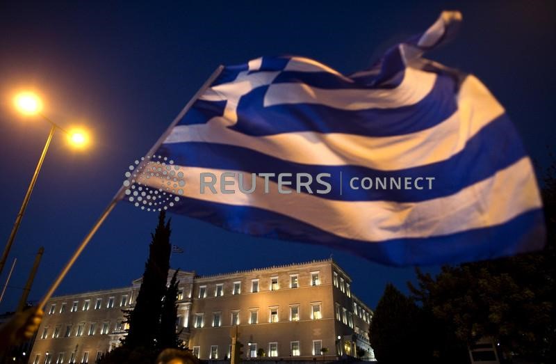 &copy; Reuters. The Greek parliament is seen behind a flag during an anti-austerity rally in Athens, Greece July 22, 2015. Greek Prime Minister Alexis Tsipras sought on Wednesday to contain a rebellion in his left-wing Syriza party ahead of a vote on a second package of 