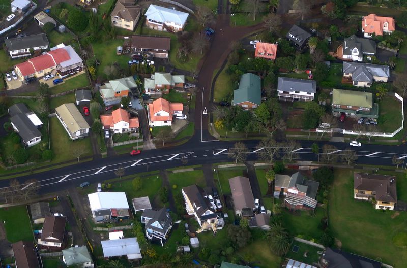 &copy; Reuters. FILE PHOTO: Residential houses can be seen along a road in a suburb of Auckland in New Zealand, June 24, 2017. REUTERS/David Gray