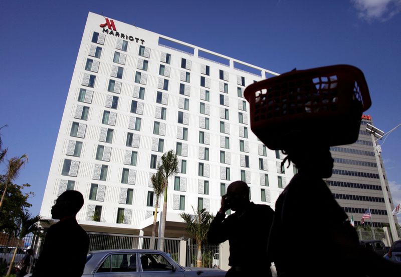 &copy; Reuters. FILE PHOTO: Pedestrians walk past the Marriott Port-au-Prince Hotel in Port-au-Prince February 24, 2015. REUTERS/Andres Martinez Casares (HAITI - Tags: BUSINESS TRAVEL)/File Photo