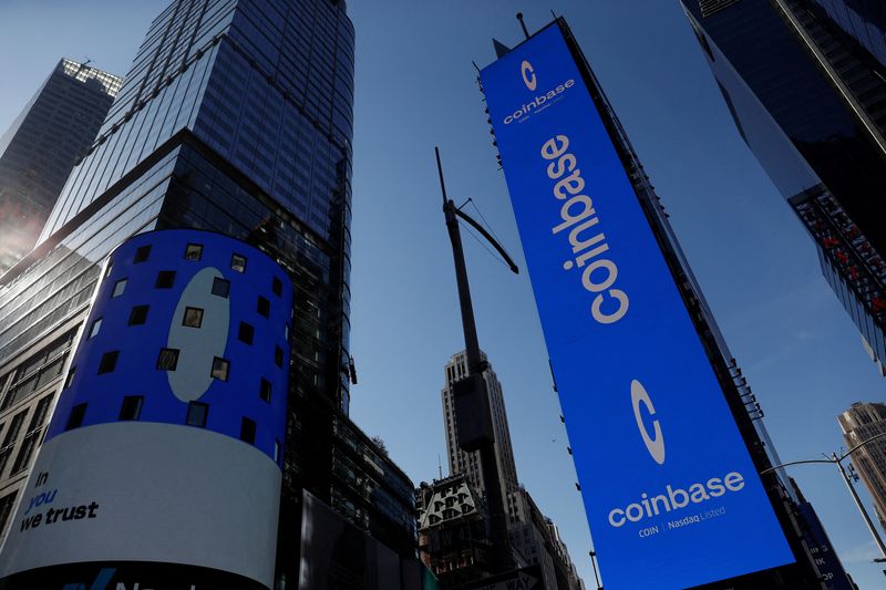 &copy; Reuters. FILE PHOTO: The logo for Coinbase Global Inc, the biggest U.S. cryptocurrency exchange, is displayed on the Nasdaq MarketSite jumbotron and others at Times Square in New York, U.S., April 14, 2021. REUTERS/Shannon Stapleton/File Photo