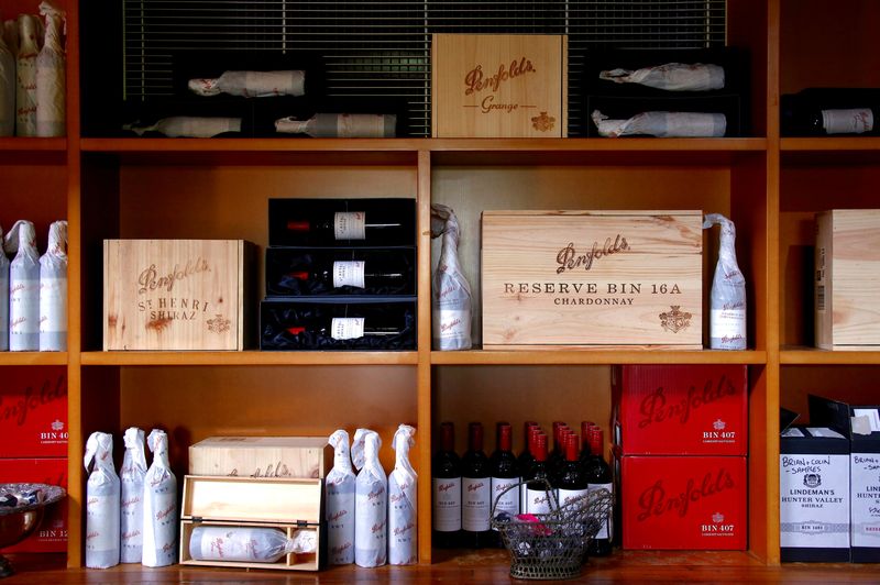 &copy; Reuters. FILE PHOTO: Bottles of Penfolds Grange wine and other varieties, made by Australian wine maker Penfolds and owned by Australia's Treasury Wine Estates, sit on shelves for sale at a winery located in the Hunter Valley, north of Sydney, Australia, February 