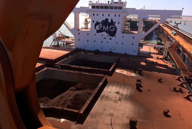 &copy; Reuters. FILE PHOTO: The logo of Australia's Fortescue Metals Group (FMG) can be seen on a bulk carrier as it is loaded with iron ore at the coastal town of Port Hedland in Western Australia, November 29, 2018. REUTERS/Melanie Burton