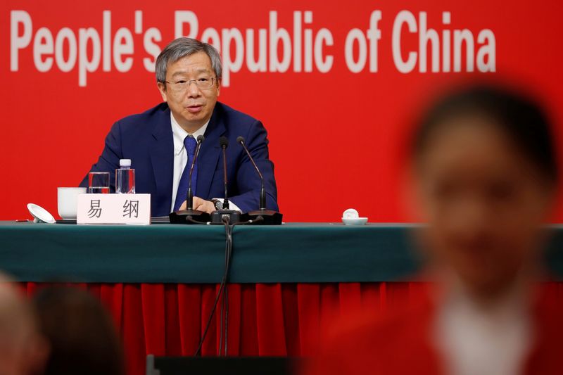 © Reuters. Governor of People's Bank of China (PBOC) Yi Gang attends a news conference on China's economic development ahead of the 70th anniversary of its founding, in Beijing, China September 24, 2019. REUTERS/Florence Lo