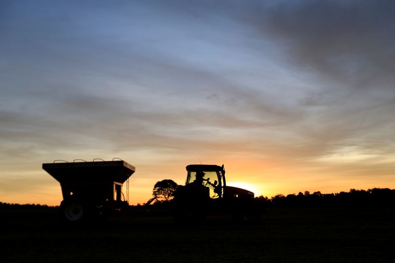 &copy; Reuters. FILE PHOTO - A tractor is silhouetted after harvesting soybeans at a farm in Caaguazu, Paraguay February 17, 2020. Picture taken February 17, 2020. REUTERS/Jorge Adorno