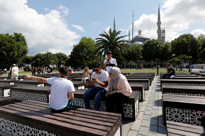 &copy; Reuters. FILE PHOTO: Foreign tourists pause at Sultanahmet Square as they visit the Old City in Istanbul, Turkey July 8, 2021. REUTERS/Dilara Senkaya