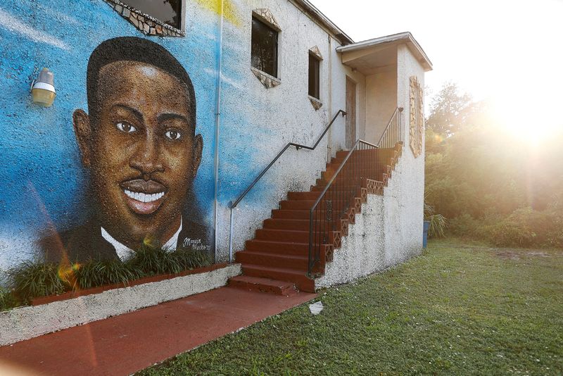 &copy; Reuters. FILE PHOTO: A mural of Ahmaud Arbery is painted on the side of the Brunswick African American Cultural Center in downtown Brunswick, Georgia, U.S. October 11, 2021.  REUTERS/ Christopher Aluka Berry/File Photo
