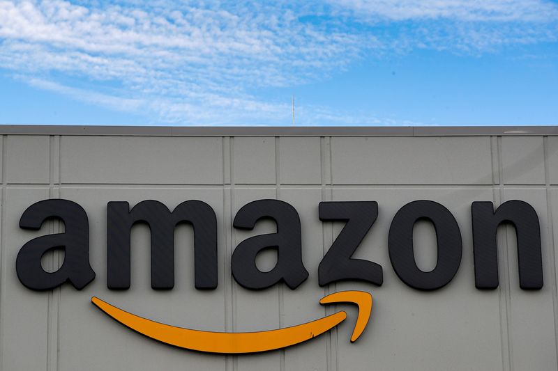 &copy; Reuters. FILE PHOTO: The Amazon logo is seen outside its JFK8 distribution center in Staten Island, New York, U.S. November 25, 2020. REUTERS/Brendan McDermid.