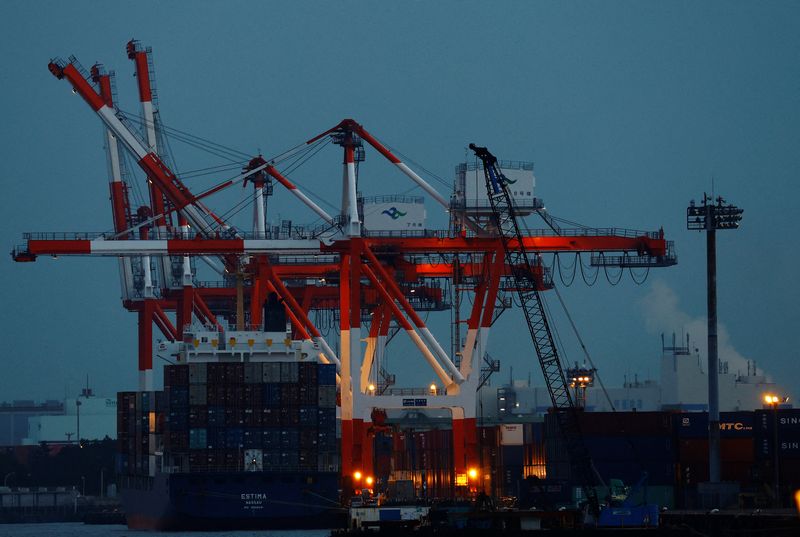 &copy; Reuters. A cargo ship and containers are seen at an industrial port in Tokyo, Japan, February 15, 2022. REUTERS/Kim Kyung-Hoon