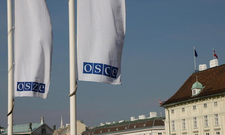 &copy; Reuters. Flags of the Organisation for Security and Cooperation in Europe (OSCE) are pictured outside their headquarters in Vienna, Austria February 15, 2022. REUTERS/Leonhard Foeger