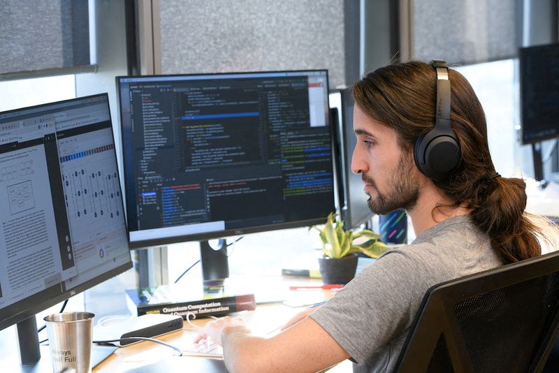 &copy; Reuters. Yoni Zimmermann, a quantum software engineer at Classiq, a startup whose platform companies can use to build quantum applications on for the quantum computer, works on the software platform, in Tel Aviv, Israel, February 2022. Classiq/Handout via REUTERS 