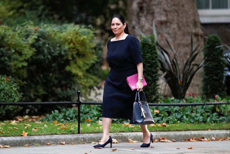 &copy; Reuters. FILE PHOTO: Britain's Home Secretary Priti Patel walks outside Downing Street in London, Britain, October 27, 2021. REUTERS/Peter Nicholls
