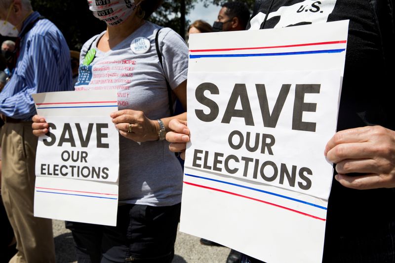 &copy; Reuters. FILE PHOTO: Protesters show support for voting rights during a rally against Texas legislators who are advancing a slew of new voting restrictions in Austin, Texas, U.S., May 8, 2021.  REUTERS/Mikala Compton/File Photo