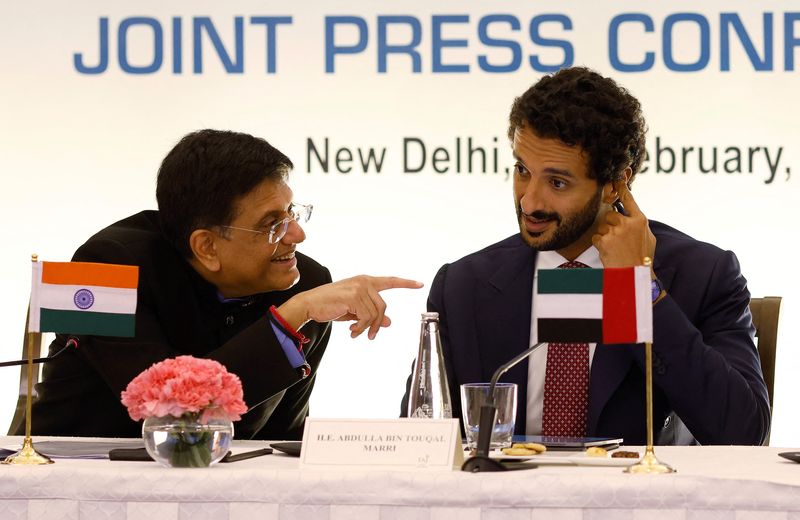 © Reuters. India's Minister of Commerce and Industry, Piyush Goyal talks to Abdulla Bin Touq Al Marri, Minister of Economy of the United Arab Emirates, (UAE), during their joint news conference in New Delhi, India, February 18, 2022. REUTERS/Adnan Abidi