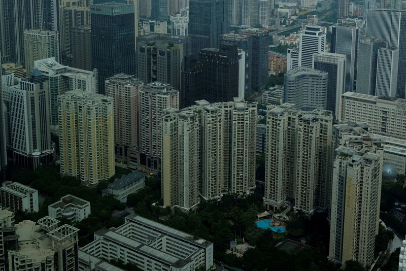 &copy; Reuters. FILE PHOTO: Residential and commercial buildings are located in downtown Guangzhou, China October 7, 2017. REUTERS/Bobby Yip