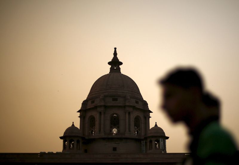 &copy; Reuters. FILE PHOTO: A commuter walks past the building of India's Ministry of Finance during dusk in New Delhi, India, in this May 18, 2015 file photo. REUTERS/Adnan Abidi/Files