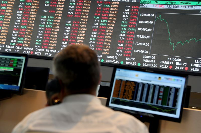 &copy; Reuters. An electronic board showing the graph of the recent fluctuations of market indices is seen as a man works on the floor of Brazil's B3 Stock Exchange in Sao Paulo, Brazil, July 25, 2019. REUTERS/Amanda Perobelli