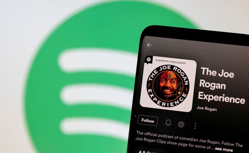 &copy; Reuters. FILE PHOTO: Joe Rogan's Spotify profile is seen in front of displayed Spotify logo in this photo illustration taken, February 7, 2022. REUTERS/Dado Ruvic/Illustration/File Photo