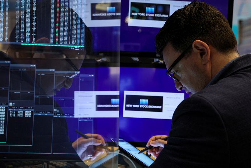 &copy; Reuters. FILE PHOTO - A trader works on the floor of the New York Stock Exchange (NYSE) in New York City, U.S., February 18, 2022.  REUTERS/Brendan McDermid